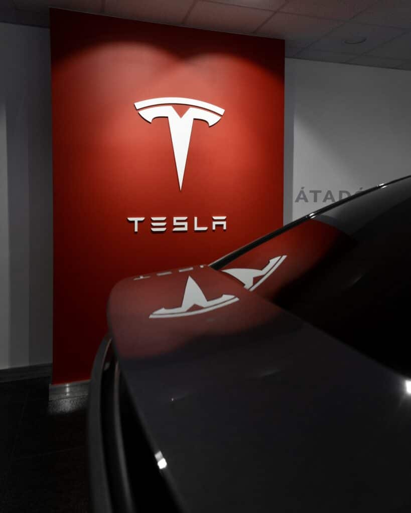 Tesla logo in a Tesla garage