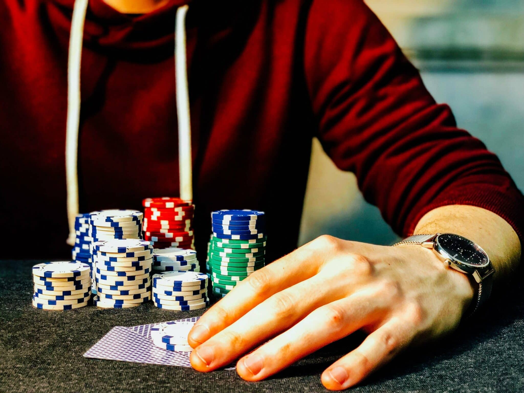 Person with large pile of poker chips