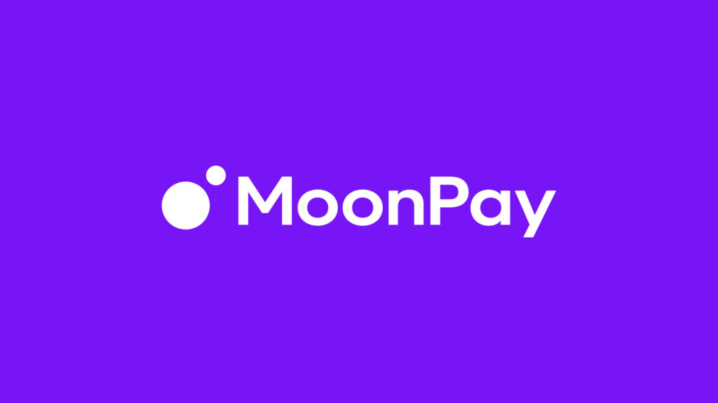 Smartphone displaying MoonPay app interface with cryptocurrency account balance, features buttons for buy, sell, and top up, and TrustScore rating of 4.2 on a promotional website banner.