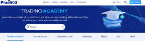 Plus500 Trading Academy homepage showcasing free guides, webinars, and educational videos to help beginners learn trading in 2025